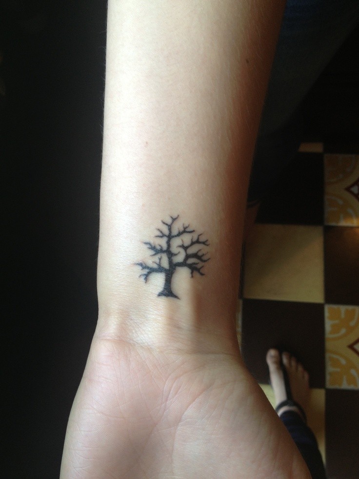 Little black tree tattoo on hand - Tattooimages.biz